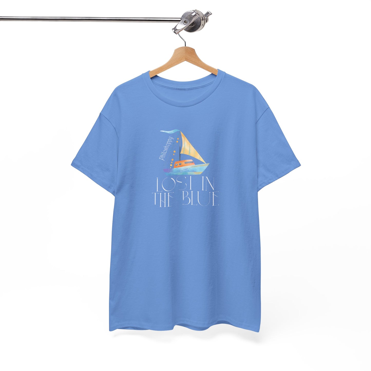 Carolina blue cotton T-shirt from Philoshoppy featuring a sailing boat illustration and the phrase 'lost in the blue', expressing ocean calm, wanderlust, and sea-inspired freedom.