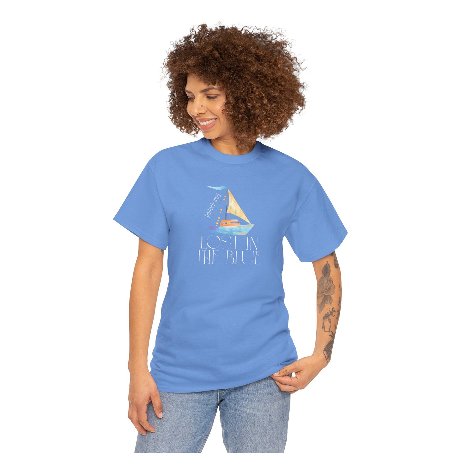 Carolina blue cotton T-shirt from Philoshoppy featuring a sailing boat illustration and the phrase 'lost in the blue', expressing ocean calm, wanderlust, and sea-inspired freedom.