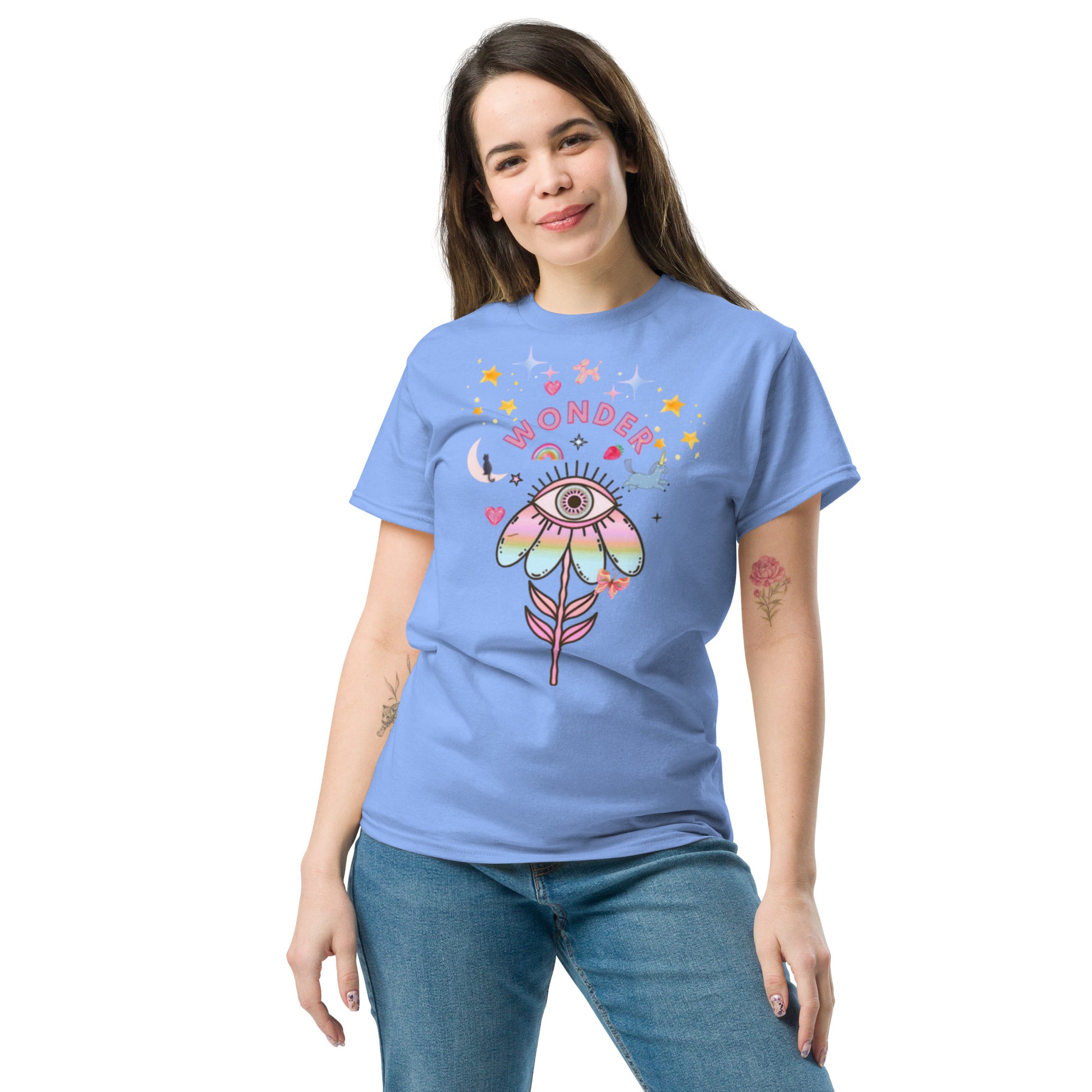 Carolina blue t-shirt with “Wonder” print and artistic details, unisex design celebrating curiosity, imagination, and mindful joy.