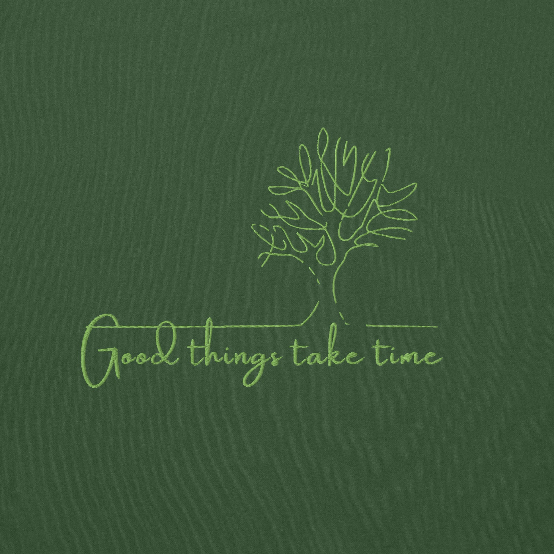 Green cotton hoodie featuring “Good Things Take Time” — a wearable reminder that progress, healing, and beauty unfold at their own pace.