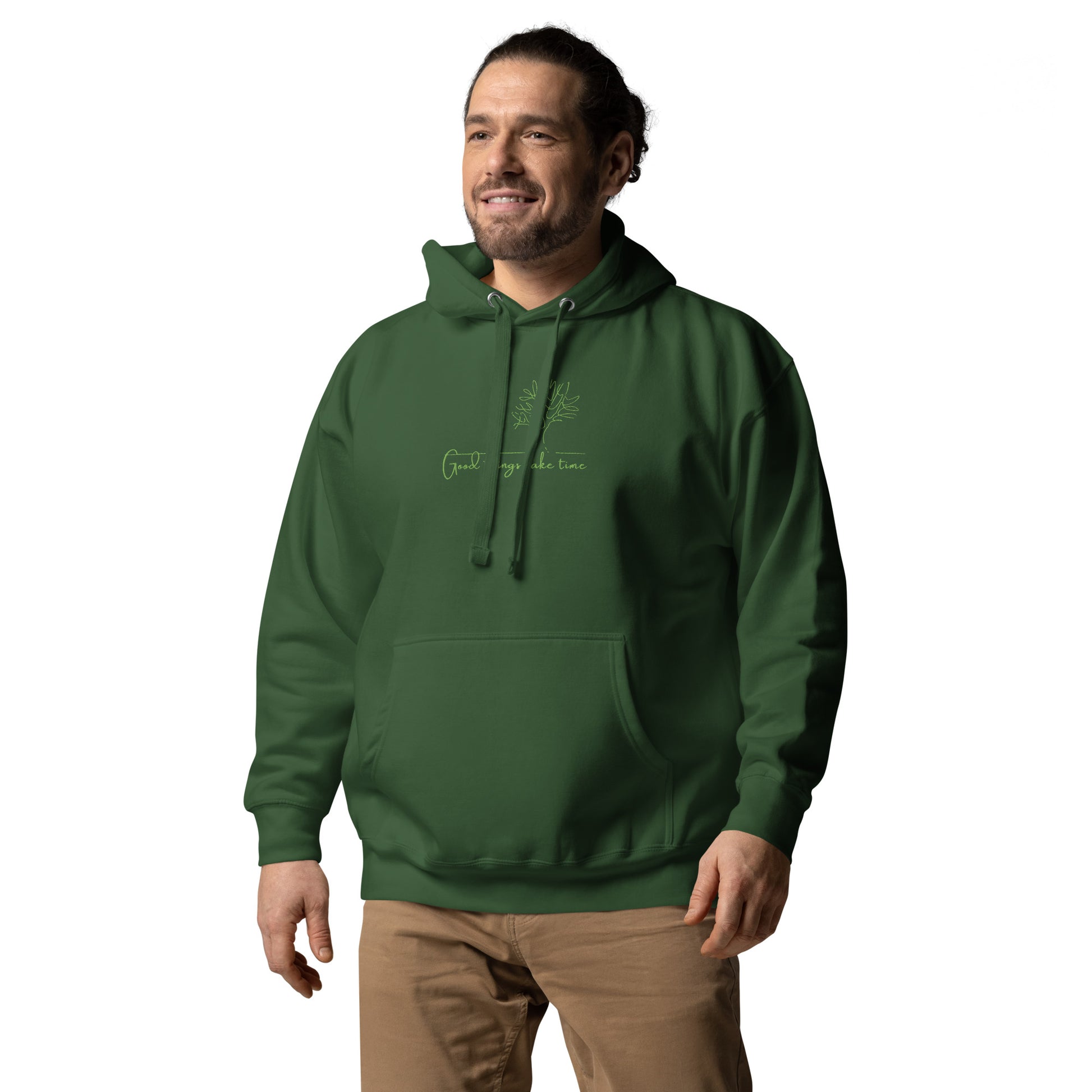 Relaxed green hoodie with “Good Things Take Time” text, unisex design symbolizing patience, growth, and mindful living.
