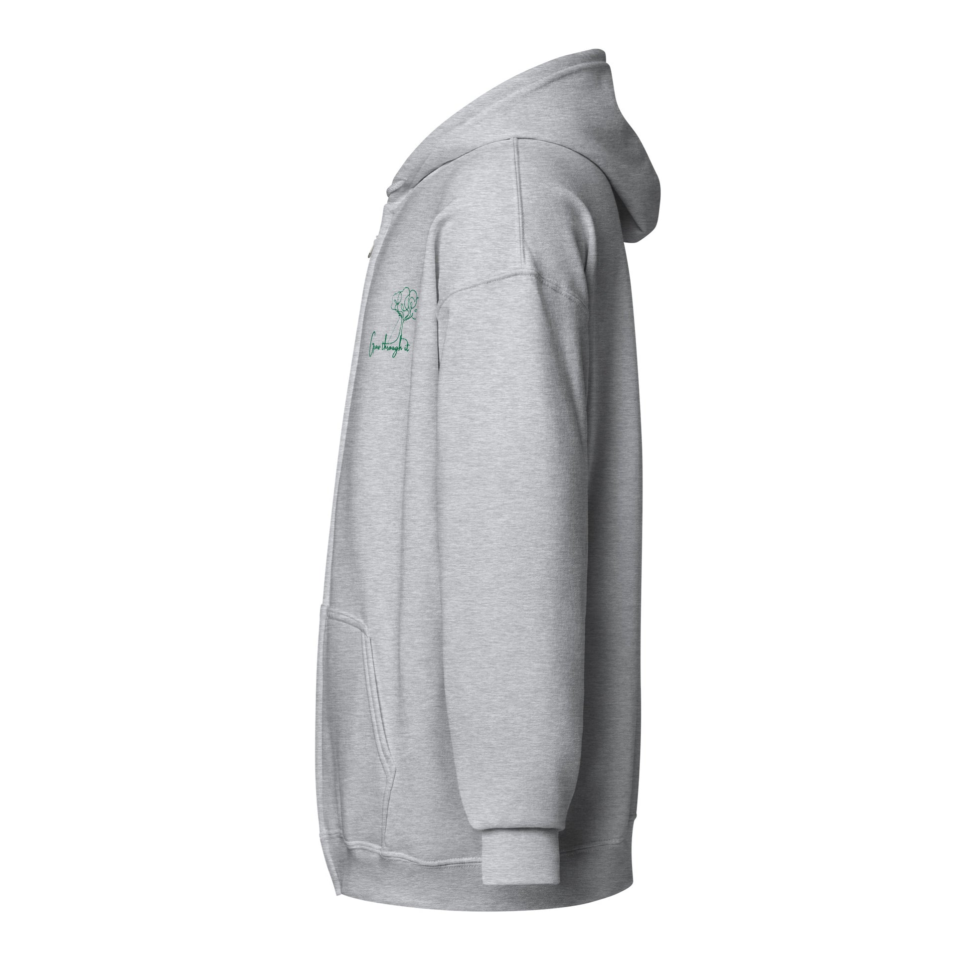 Grey embroidered zipped hoodie with “Grow Through It” and simple tree motif, unisex design symbolizing resilience, growth, and renewal.