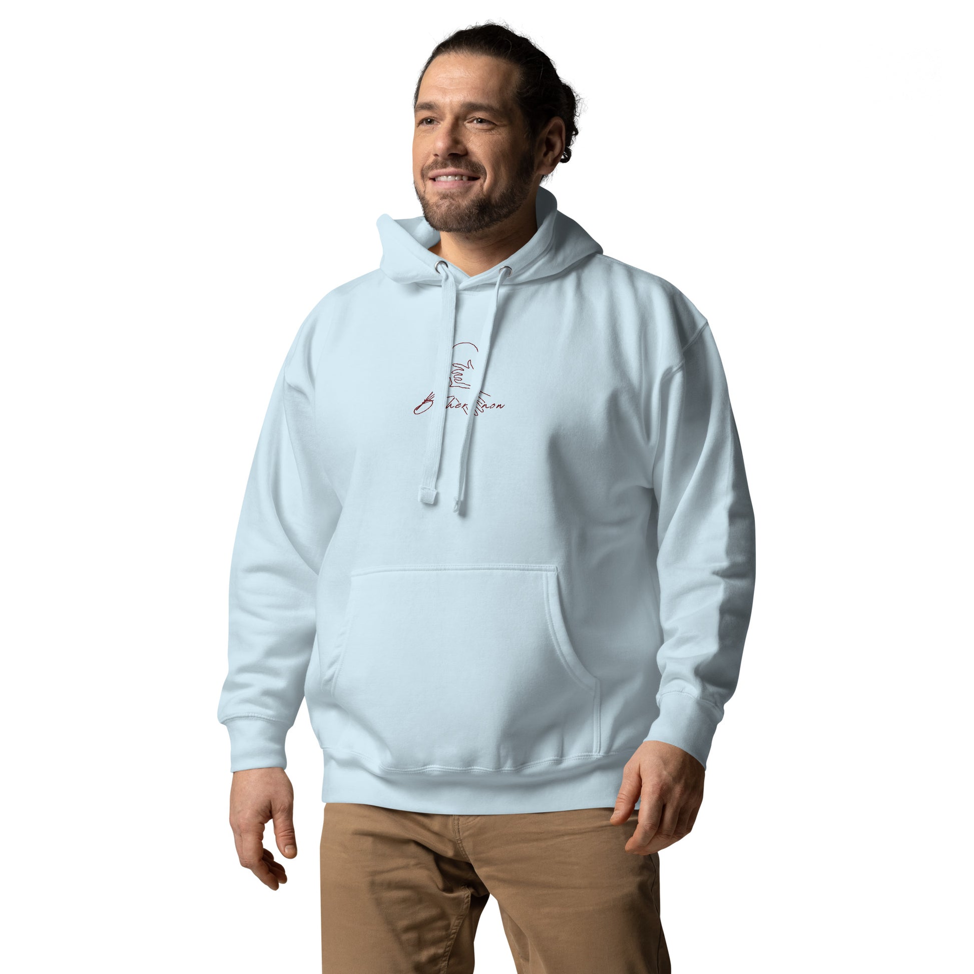 Relaxed light blue hoodie with “Be Here Now” text, unisex design symbolizing mindfulness, calm, and intentional living.