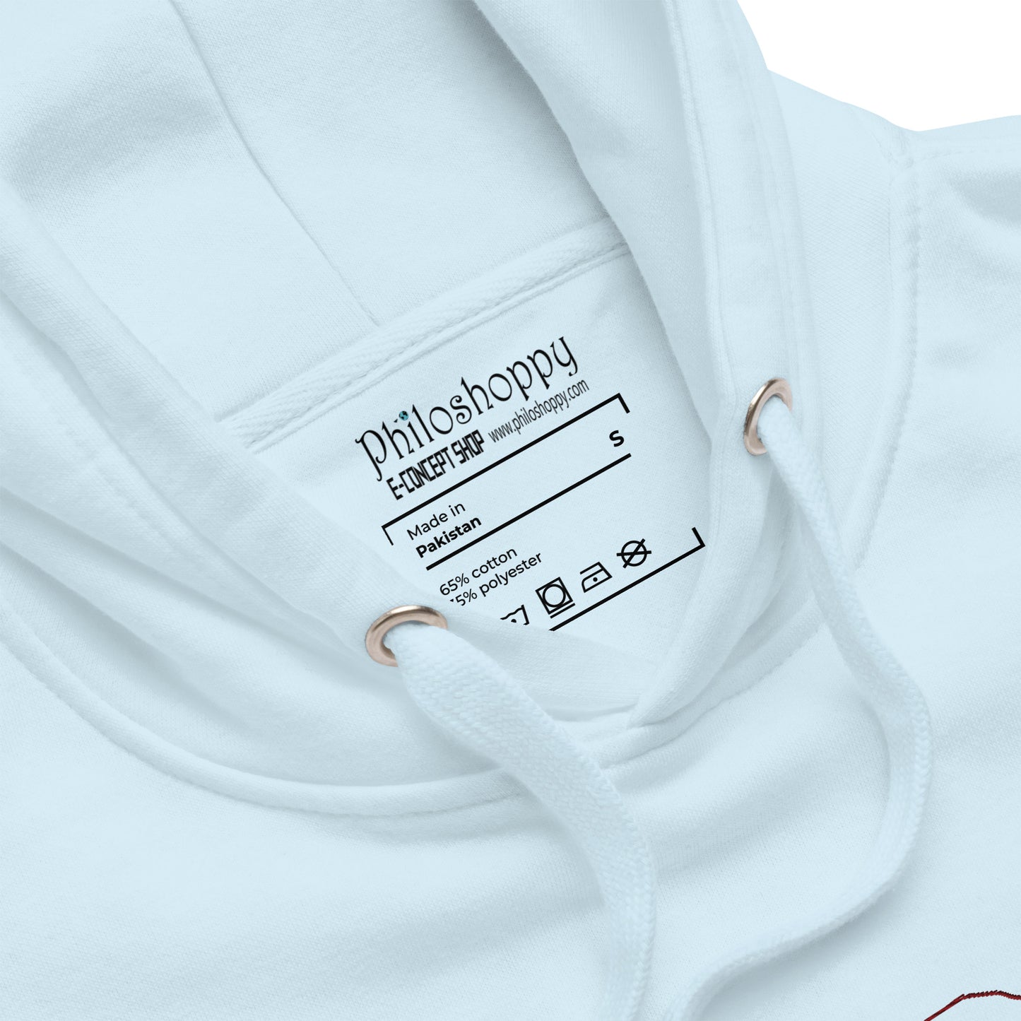 detail of Relaxed light blue hoodie with “Be Here Now” text, unisex design symbolizing mindfulness, calm, and intentional living.