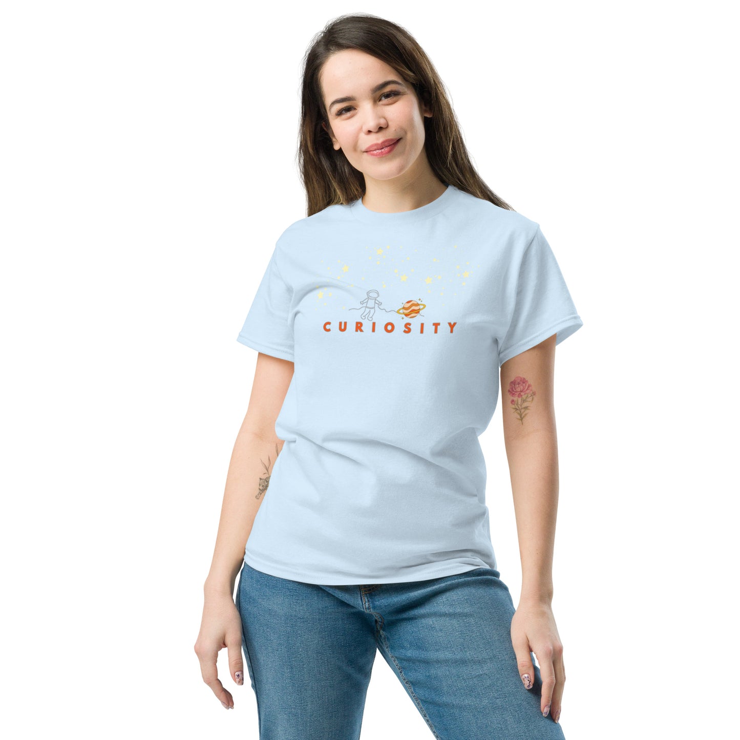 Light blue cotton t-shirt with “Curiosity” print and simple astronaut illustration, unisex design symbolizing exploration, wonder, and imagination.