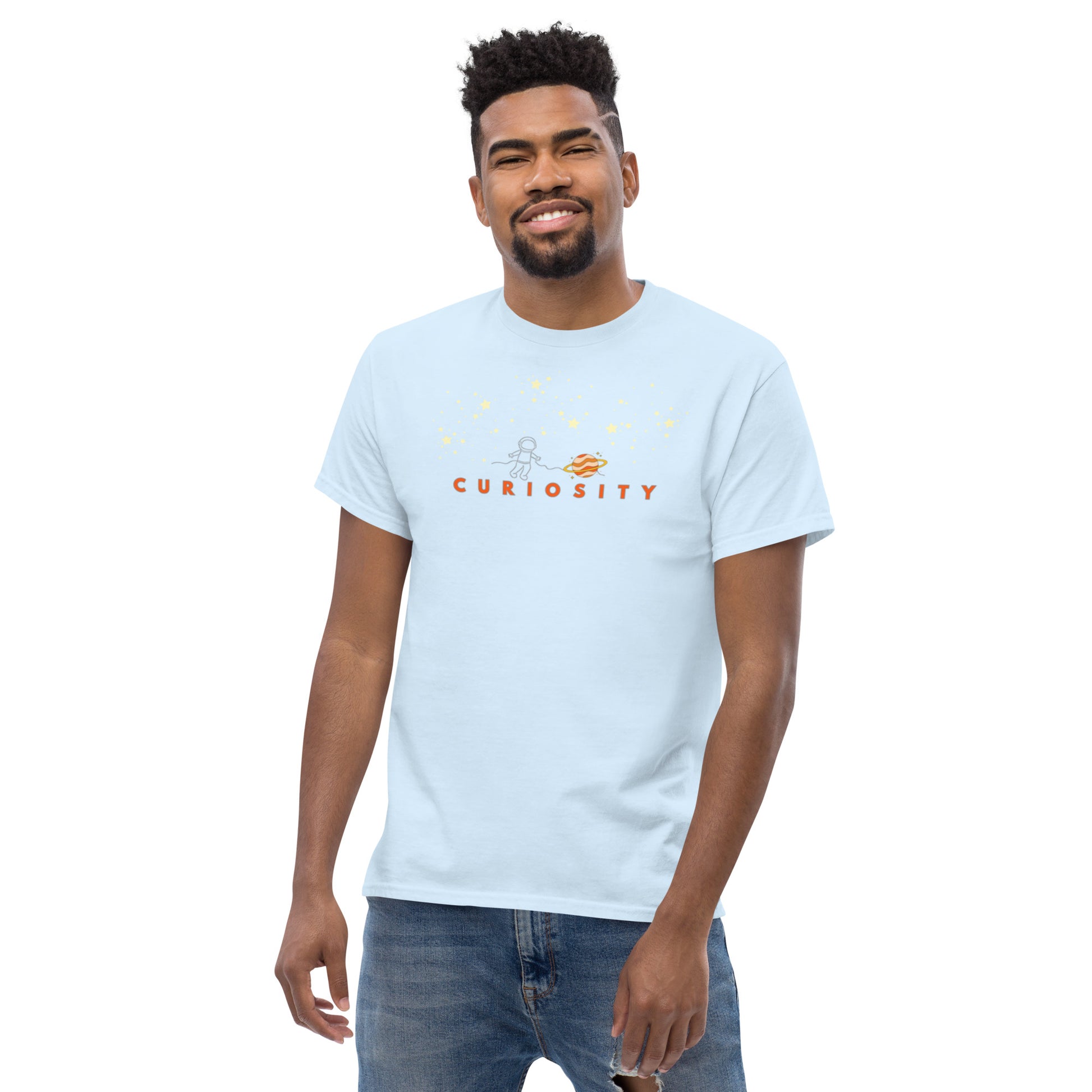 Light blue unisex cotton t-shirt featuring “Curiosity” and a minimal spaceman among stars, a wearable reminder to keep seeking, learning, and discovering the unknown.
