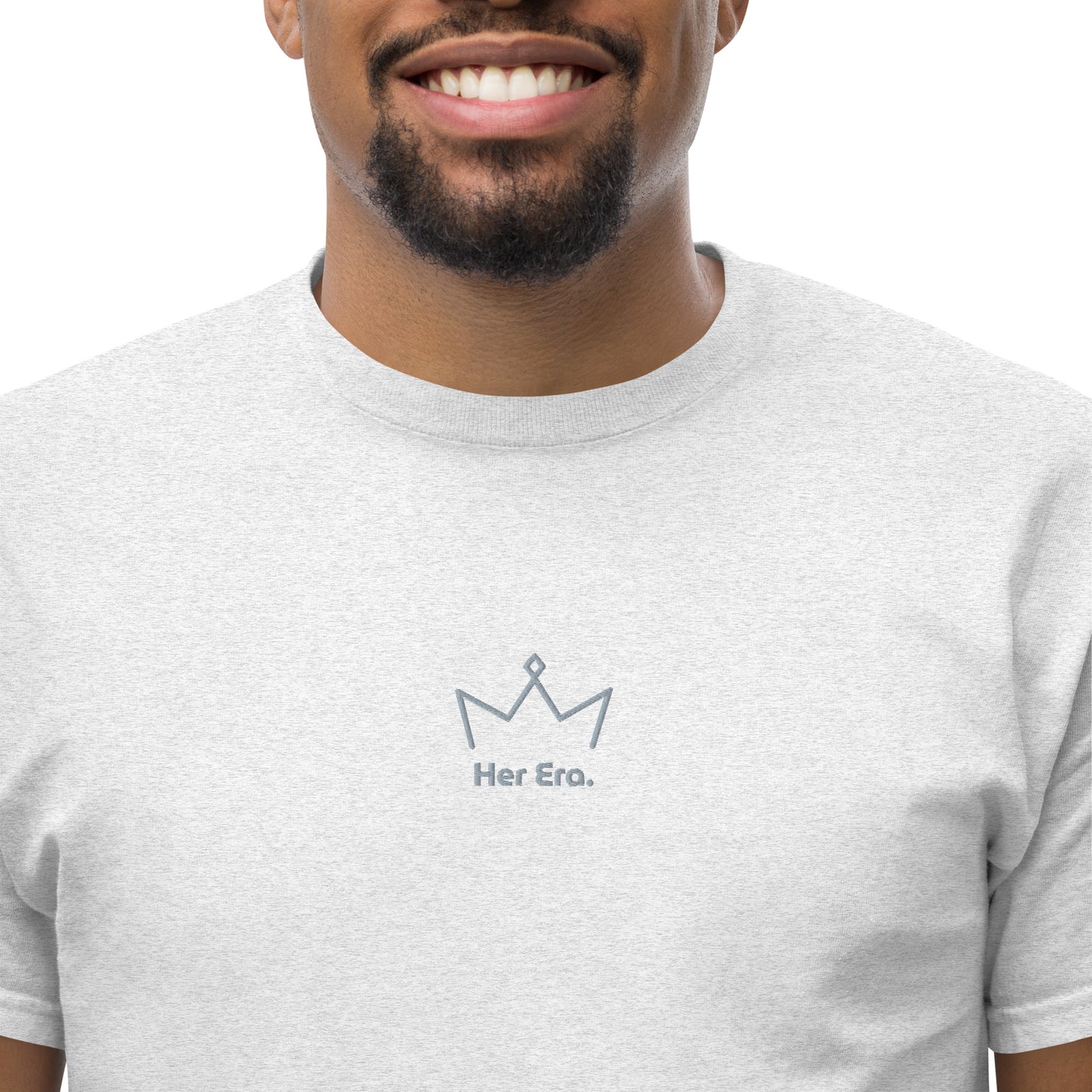 Close-up of man wearing ash grey “My Era” unisex T-shirt with minimal crown illustration, supporting empowerment and confidence.