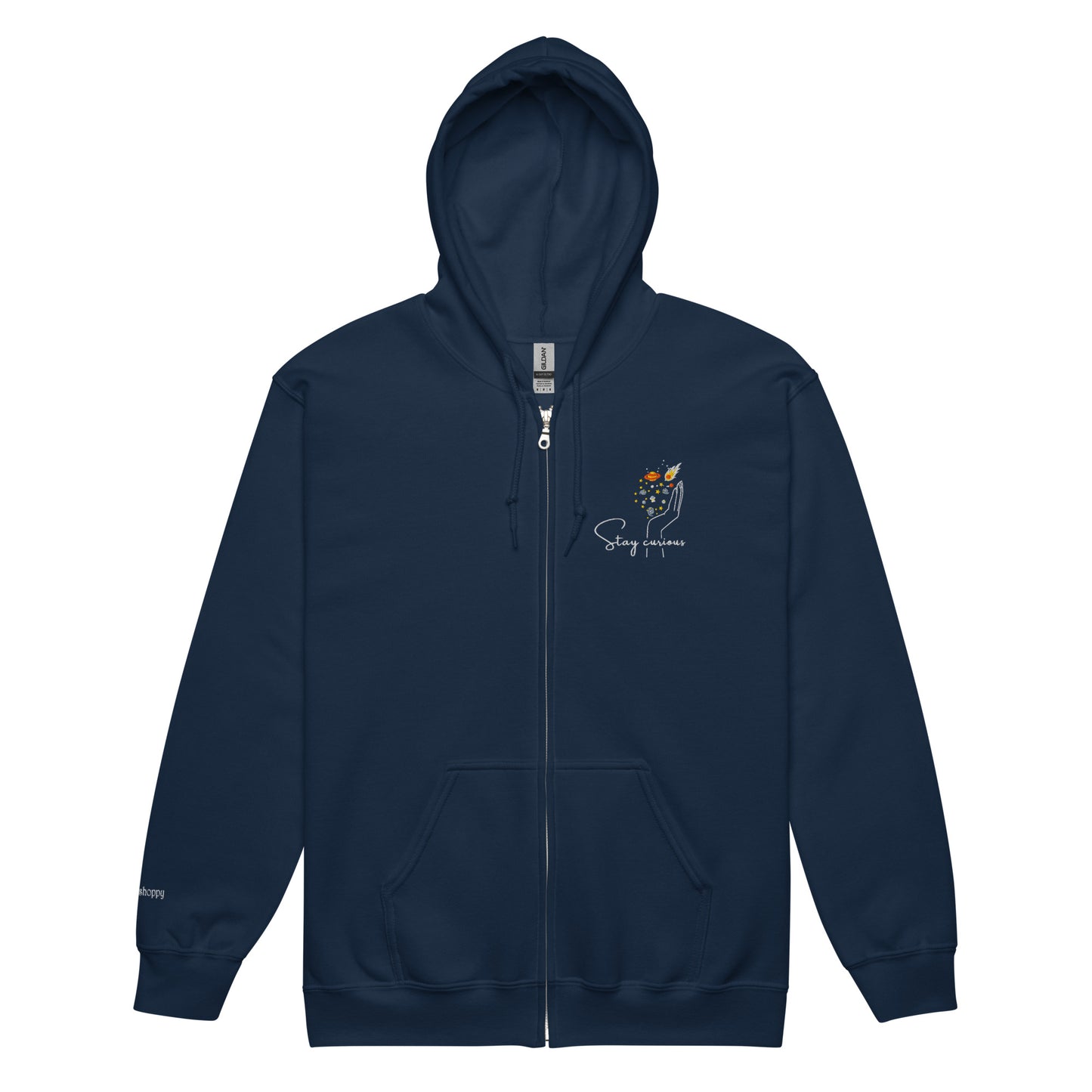 Navy blue cotton hoodie featuring “Stay Curious” and a hand cradling the galaxy, a wearable reminder to keep exploring the unknown with openness and awe.
