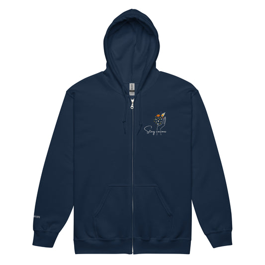 Navy blue cotton hoodie featuring “Stay Curious” and a hand cradling the galaxy, a wearable reminder to keep exploring the unknown with openness and awe.