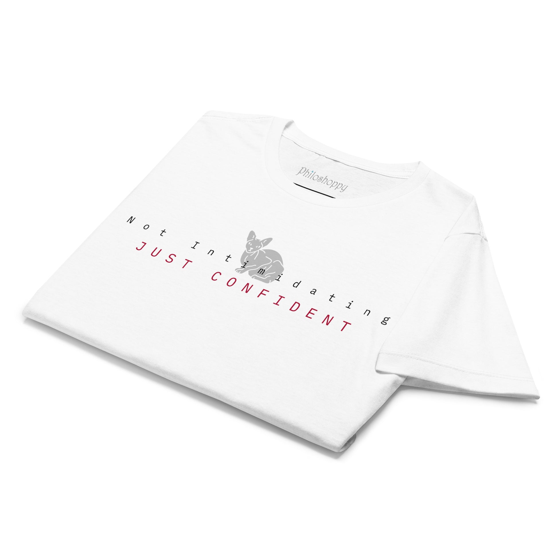 Folded white women’s T-shirt with “Not Intimidating, Just Confident” print.