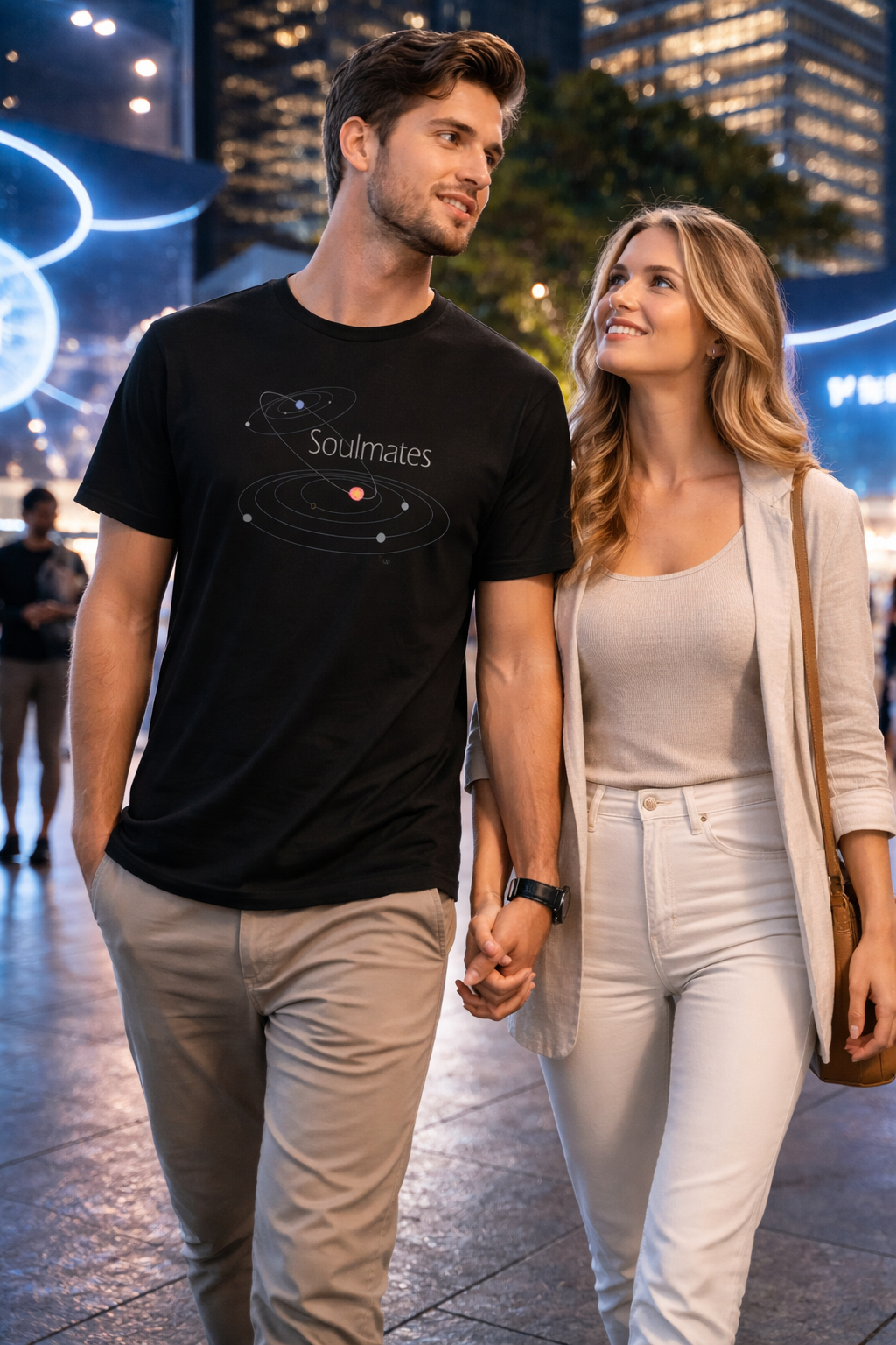 Man and woman holding hands in an urban setting at night.