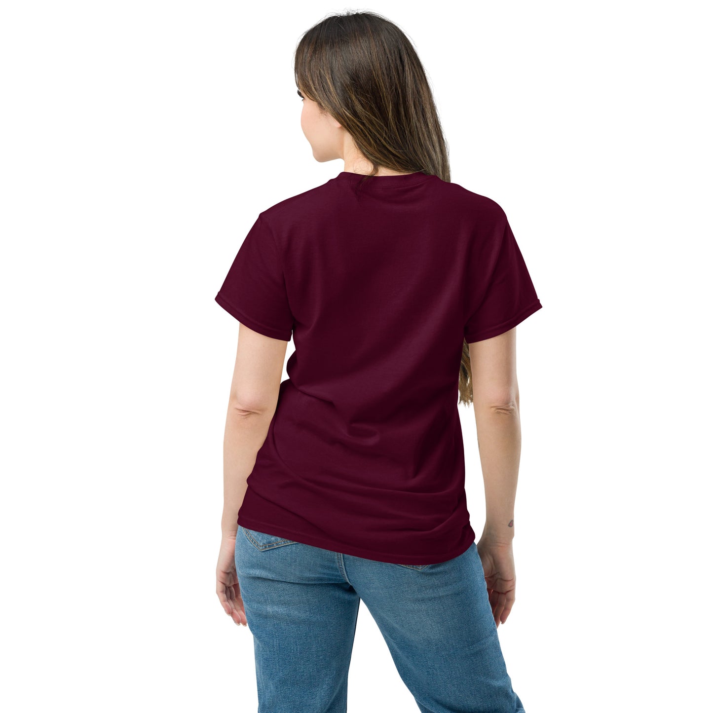 Back of a Female model wearing maroon “She. Always.” unisex cotton T-shirt, celebrating women’s strength and consistency.