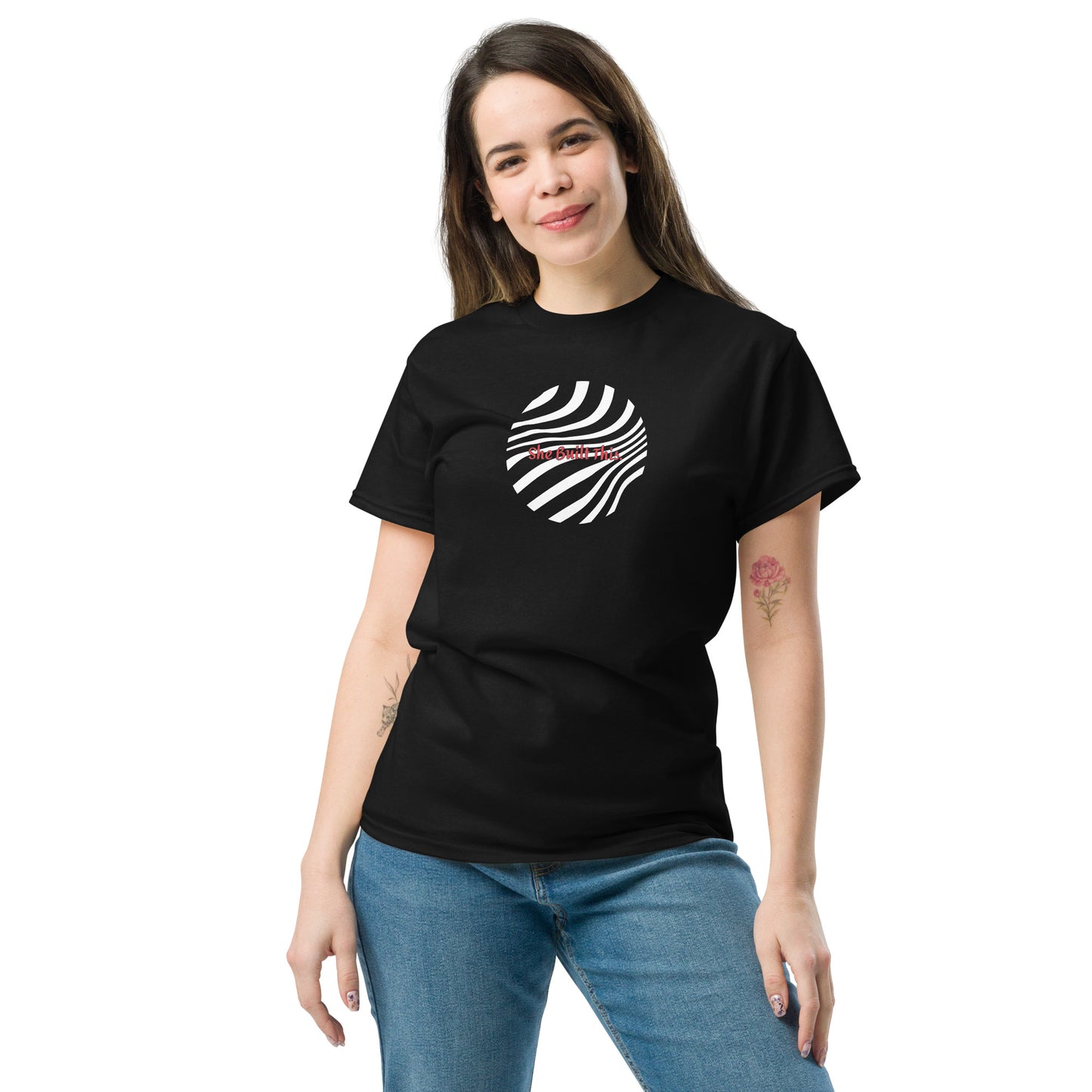 Female model wearing black “She Built This” unisex T-shirt with minimal design, celebrating women’s empowerment.