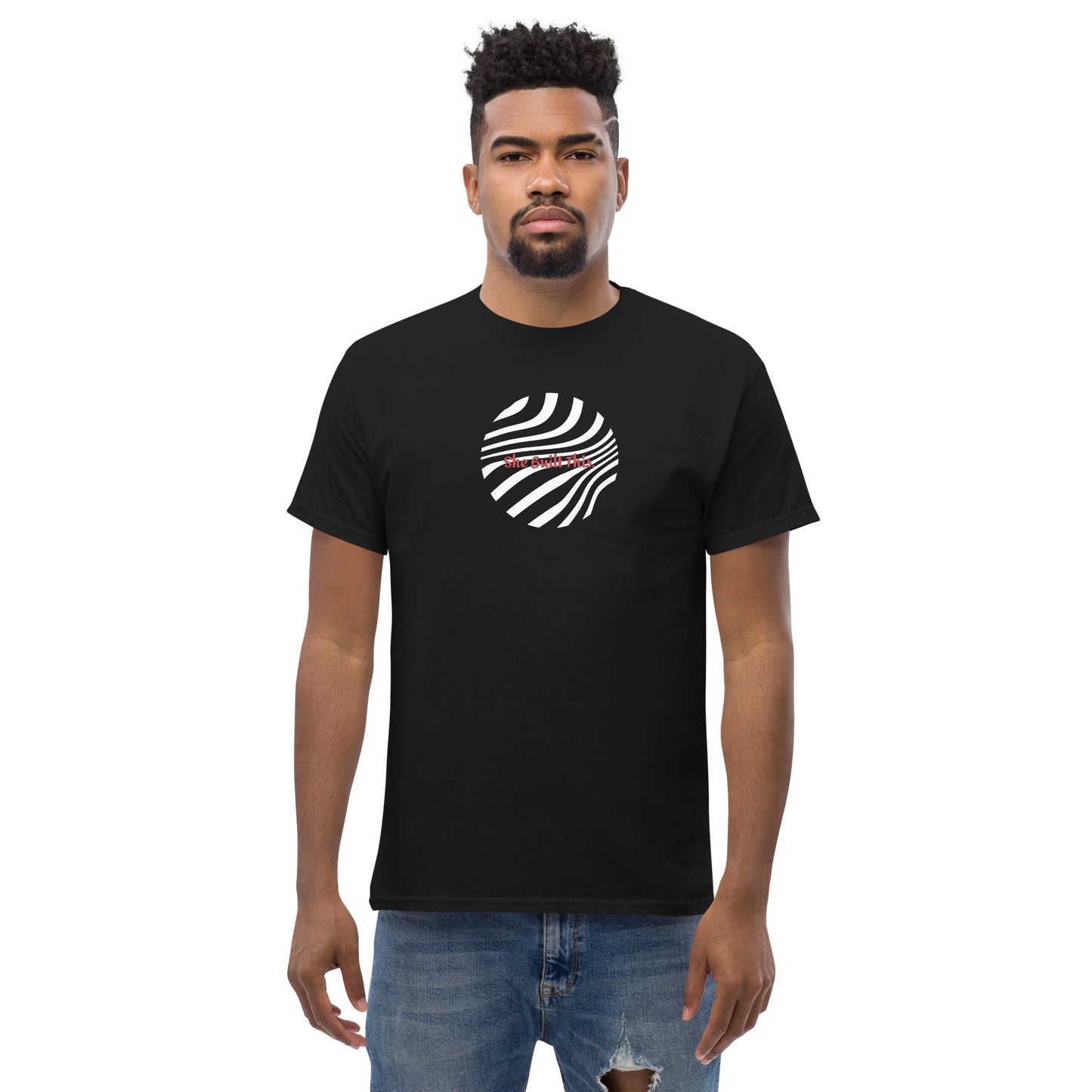 Male model wearing black “She Built This” unisex T-shirt with minimal design, showing support for women’s empowerment.
