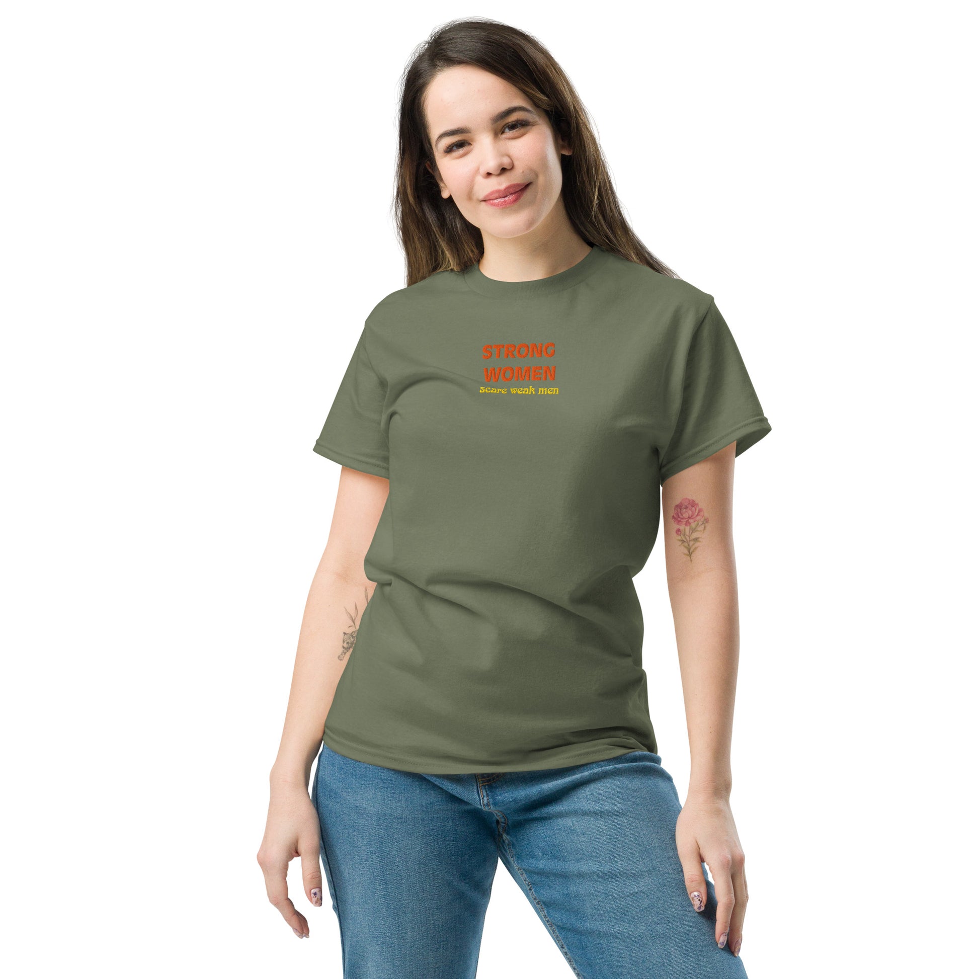 Female model wearing military green “Strong Women Scare Weak Men” unisex cotton T-shirt, celebrating strength and empowerment.