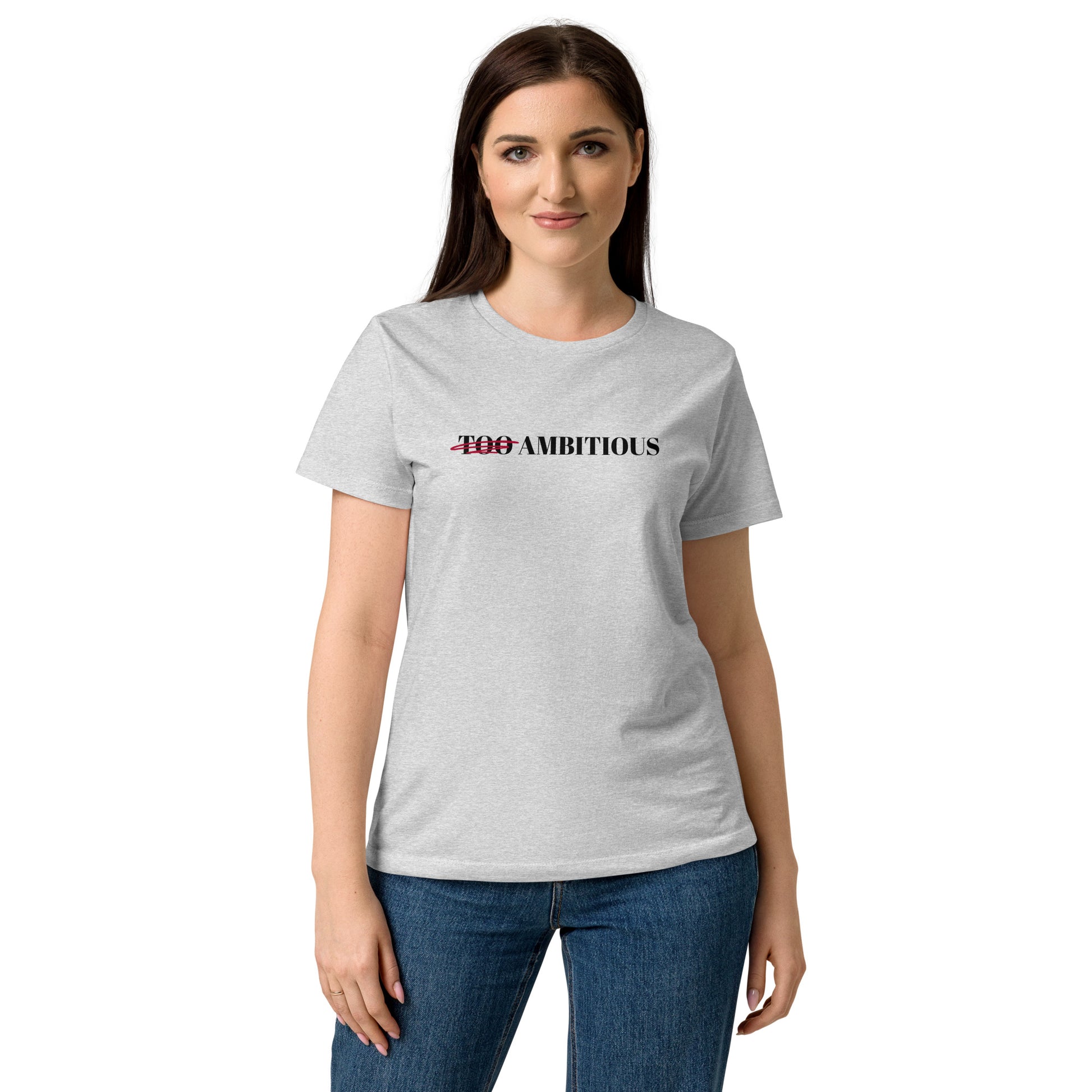 Woman model wearing grey softstyle T-shirt with “Too Ambitious” design where the word “Too” is crossed out.
