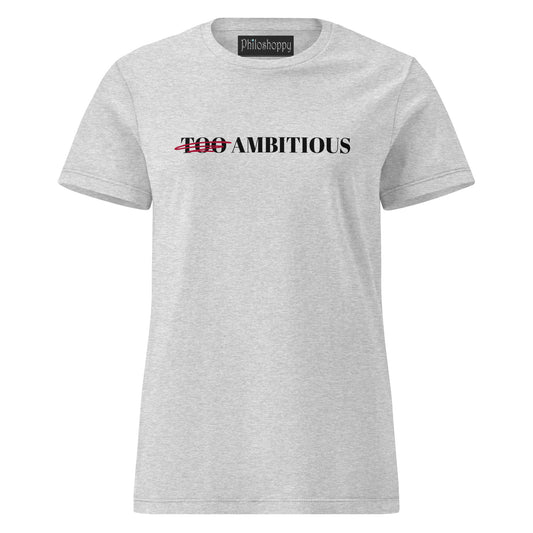 Front view of grey women’s softstyle cotton T-shirt with “Too Ambitious” design where the word “Too” is crossed out.