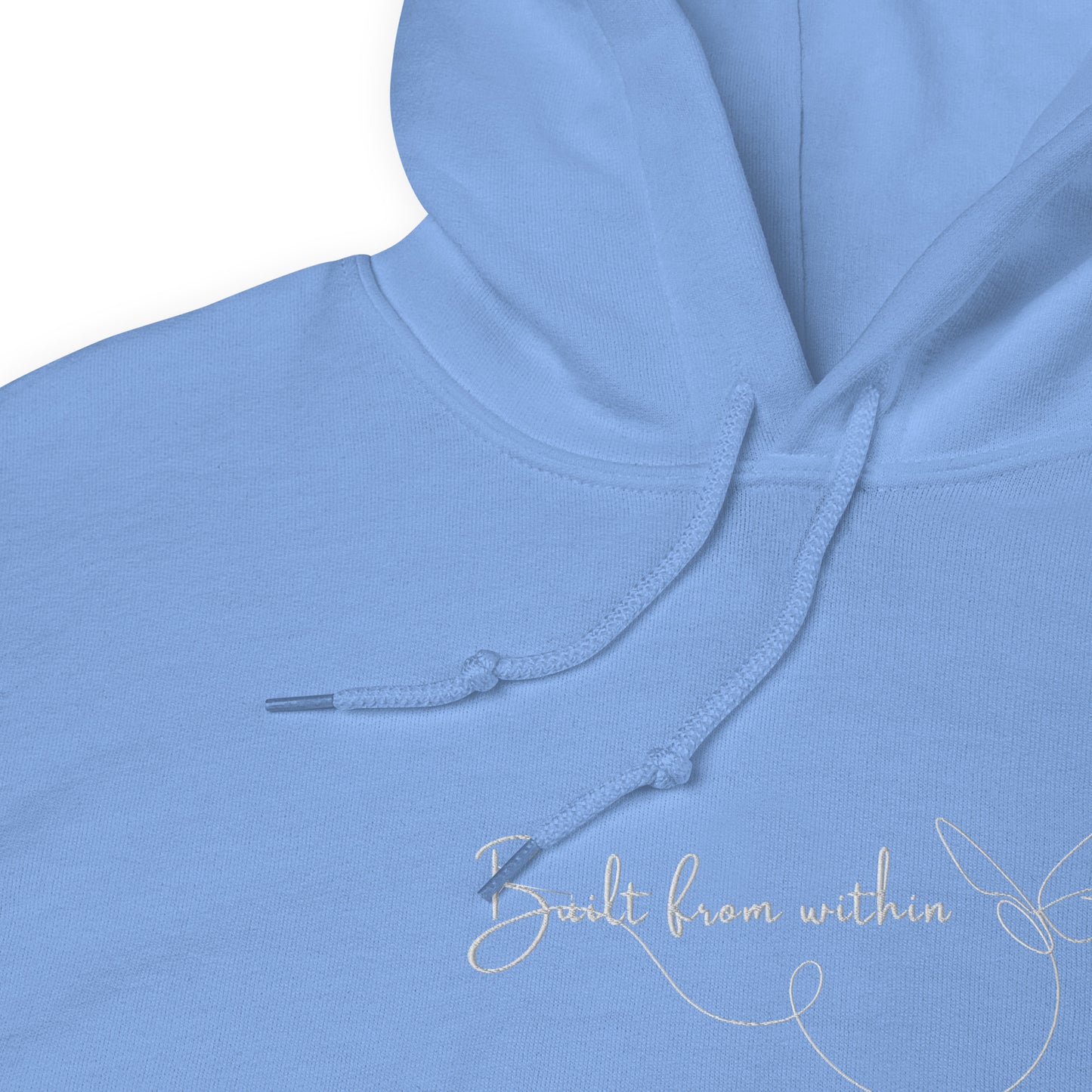 Relaxed light blue hoodie with “Build From Within” embroidered text, unisex design symbolizing inner strength, growth, and self-trust.