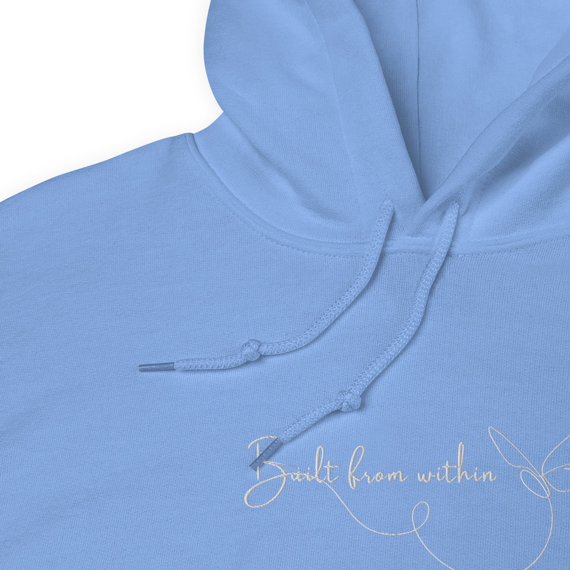Relaxed light blue hoodie with “Build From Within” embroidered text, unisex design symbolizing inner strength, growth, and self-trust.
