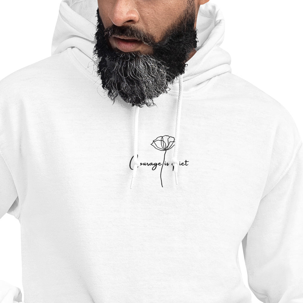 Close-up of Relaxed white hoodie with “Courage Is Quiet” embroidered text, unisex design symbolizing inner strength, calm, and resilience.