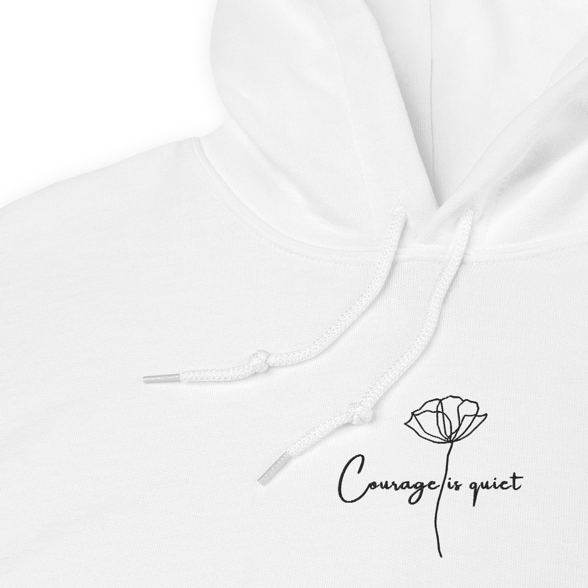 details of White embroidered hoodie featuring the phrase “Courage Is Quiet”, a wearable reminder that real strength often speaks in calm actions, not noise.