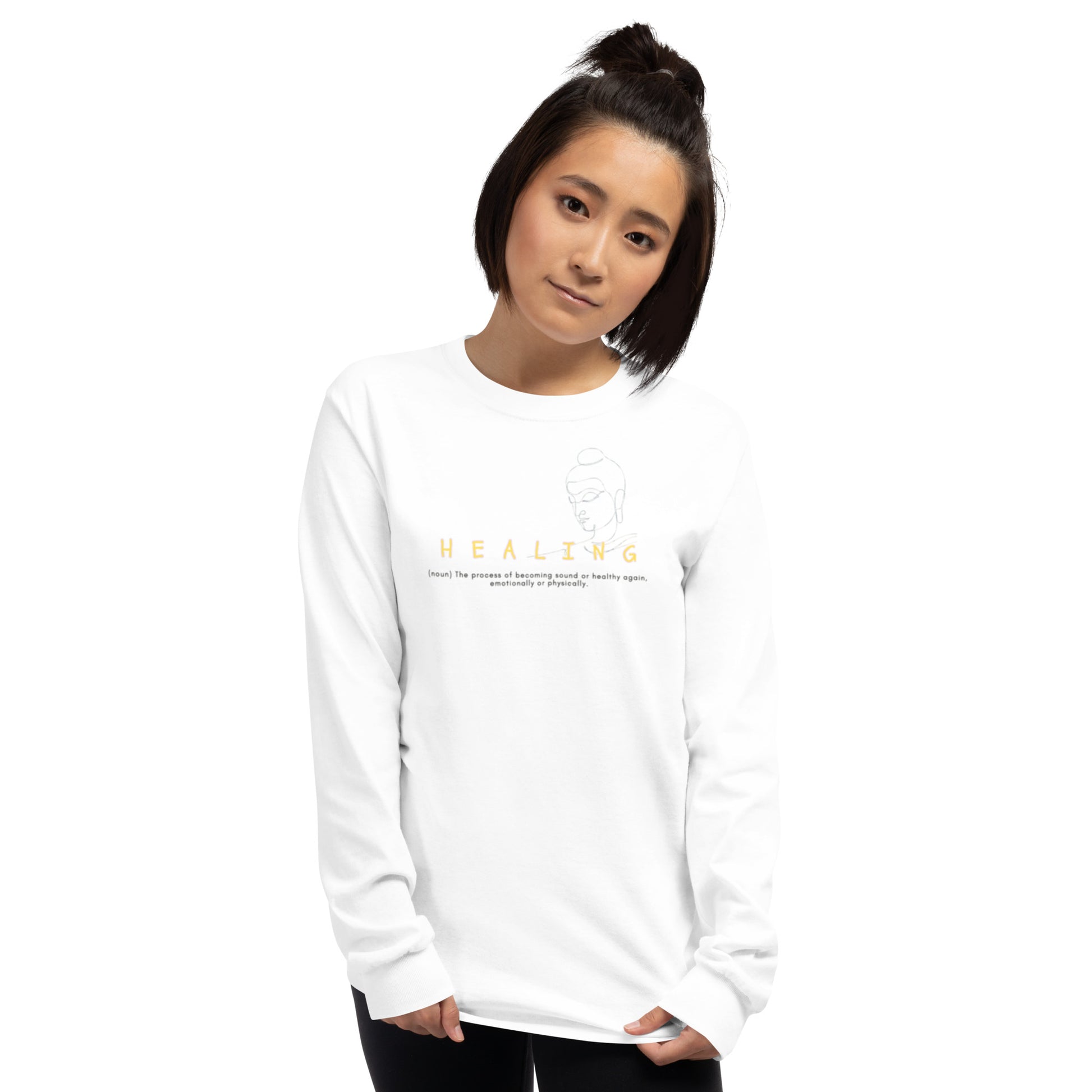 White long-sleeve tee with “Healing (noun)” definition print and Buddha illustration, unisex shirt symbolizing calm, renewal, and mindfulness.