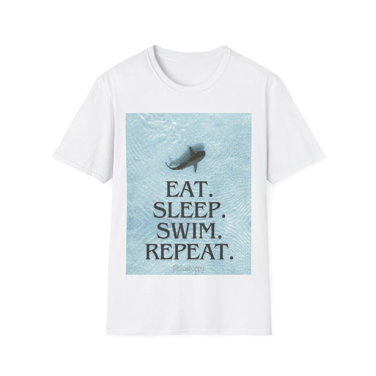White T-shirt from Philoshoppy concept e-shop featuring an aerial view of a shark swimming in shallow water and the phrase 'eat, sleep, swim, repeat', capturing the relaxed rhythm of a summer state of mind