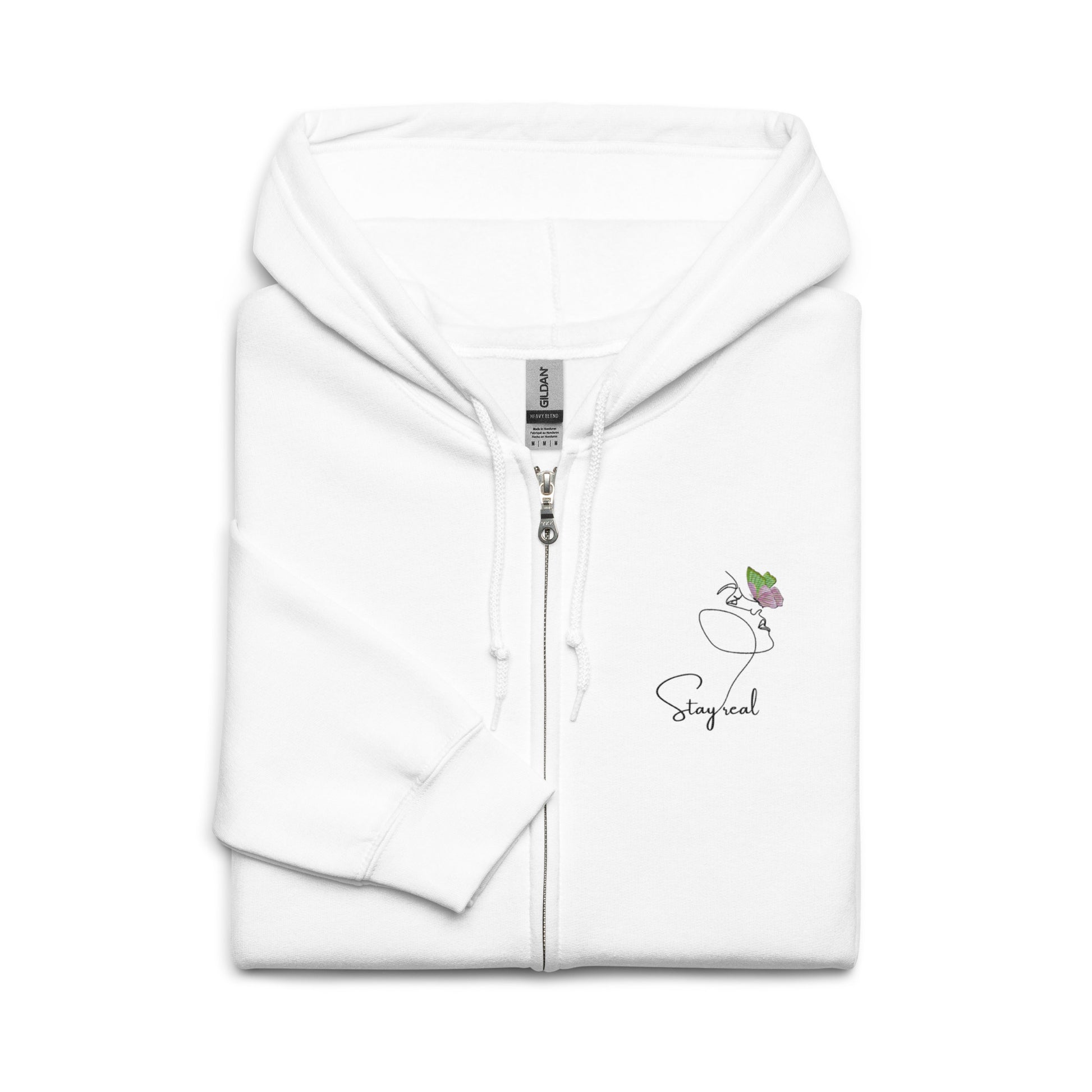 White cotton zipped hoodie featuring “Stay Real” and minimalist line art of a woman with a butterfly, a wearable reflection on self-acceptance and quiet transformation.