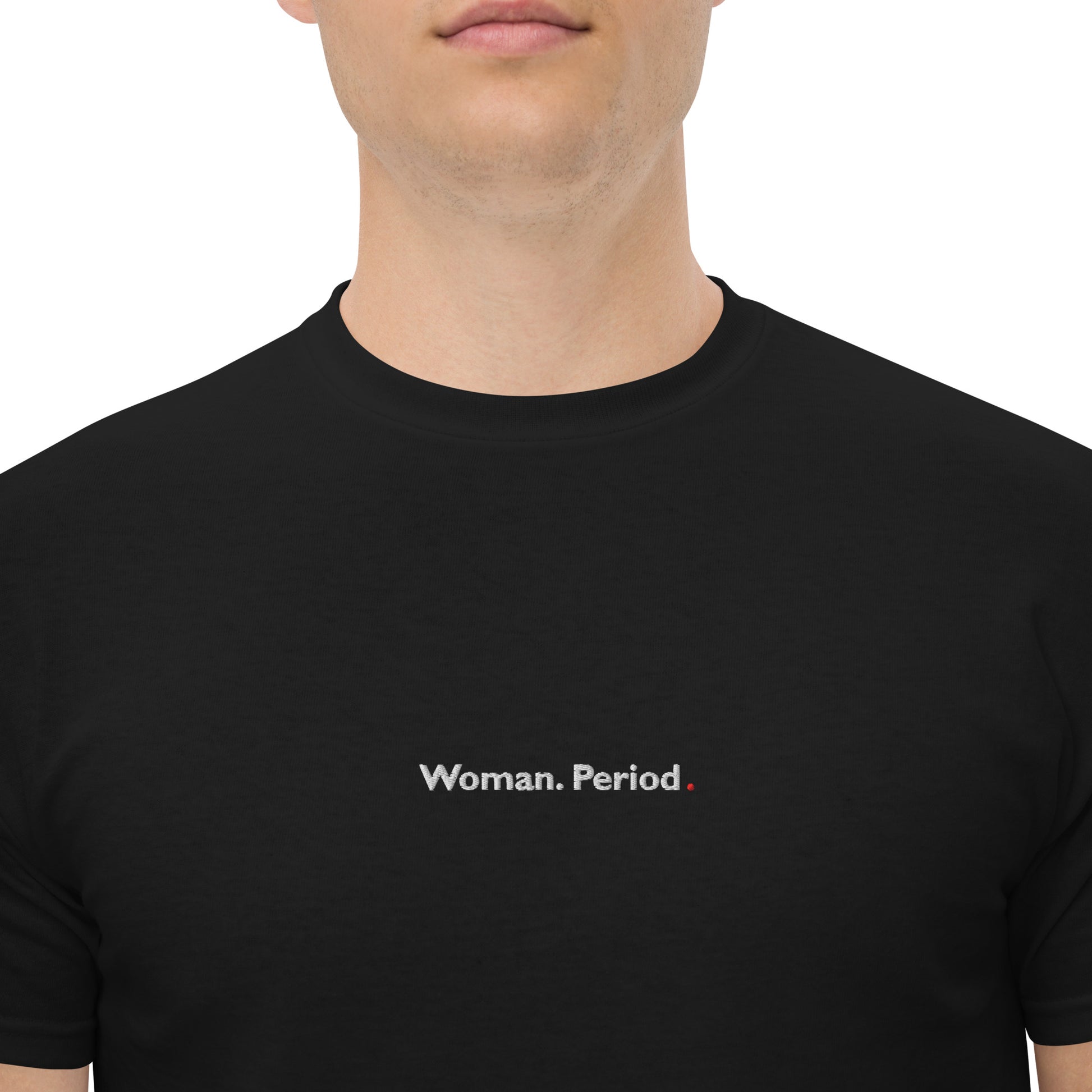 Zoomed in male model wearing black “Woman. Period.” unisex cotton T-shirt, supporting women’s empowerment.