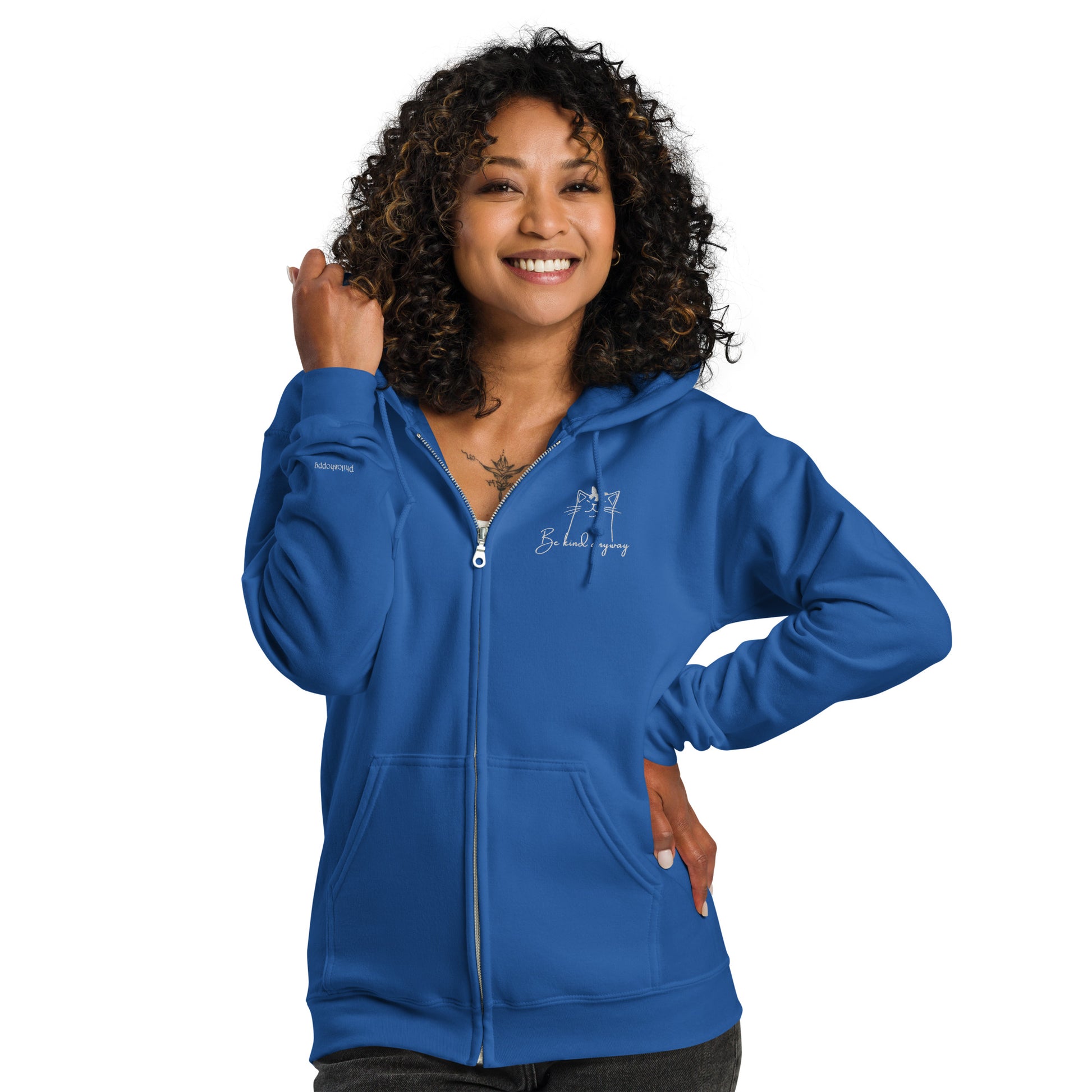 Royal blue unisex cotton zipped hoodie featuring “Be Kind Anyway” embroidery with a minimalist cat, a wearable reminder to lead with kindness, no matter the day.